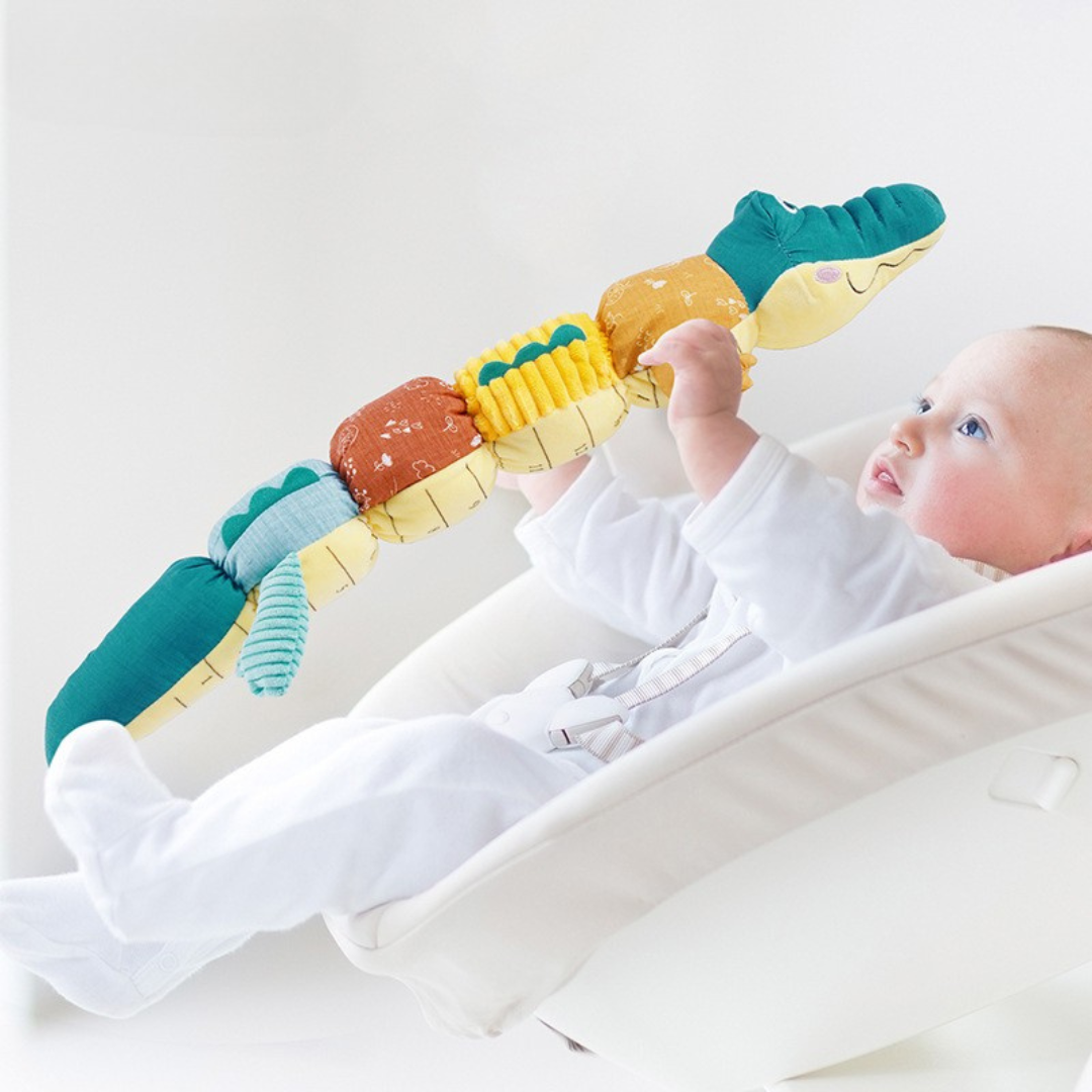 Sensorisches Plüsch Rassel und Musik Krokodil